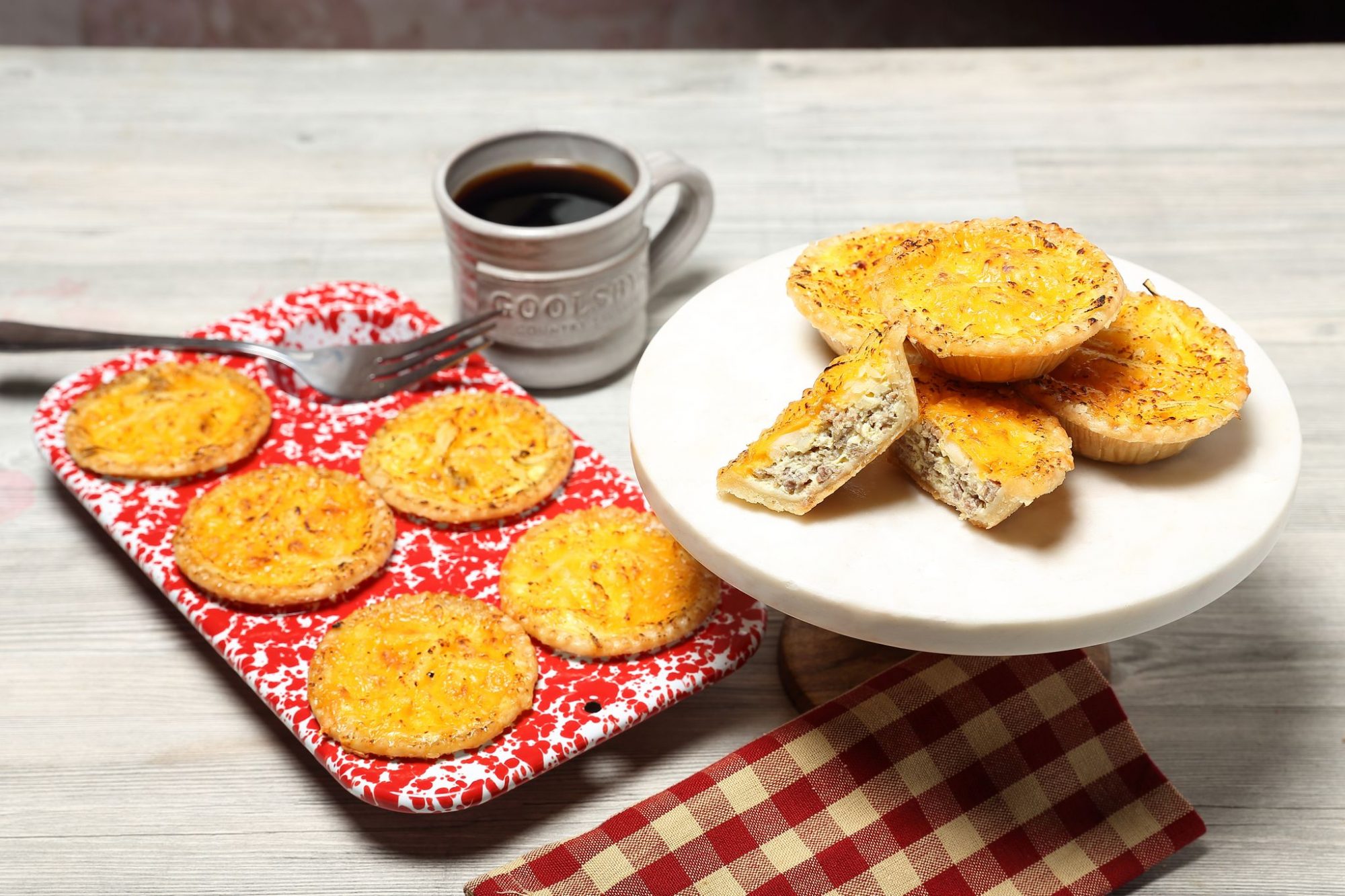 Sausage, cheese and hashbrown breakfast tarts with a cup of coffee