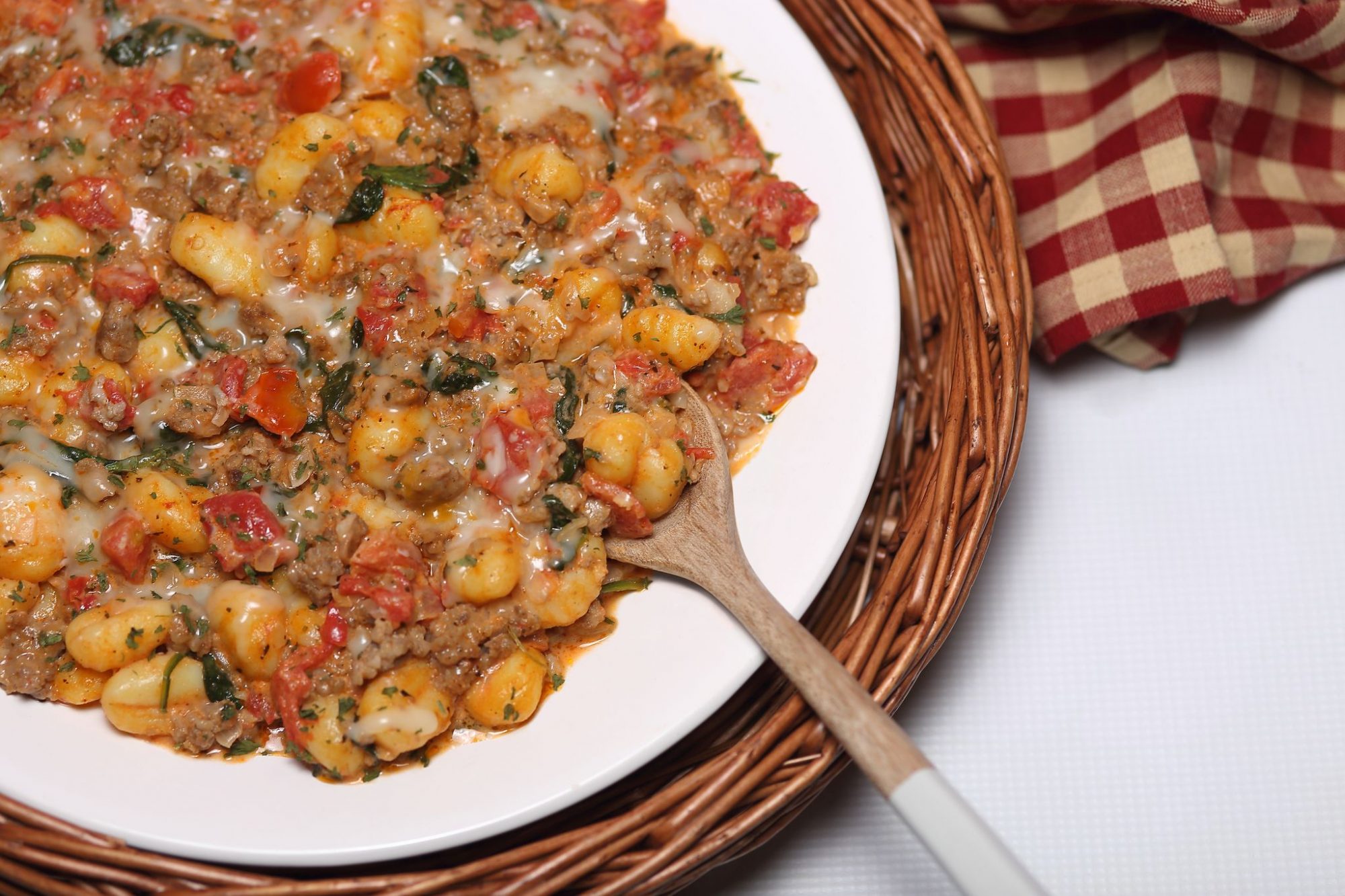 Gnocchi pasta mixed with sausage, sun-dried tomatoes and spinach